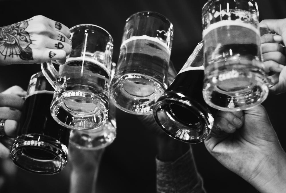 people-making-toast-with-beers